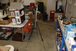 A metal ware travelling artists easel