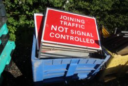 Dolav containing large quantity of road signs.