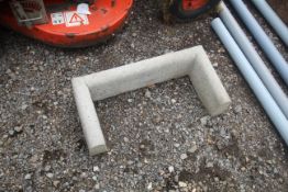 Concrete drain surround.