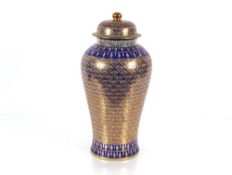 A large Oriental porcelain and enamel decorated vase, having foliate decoration heightened in
