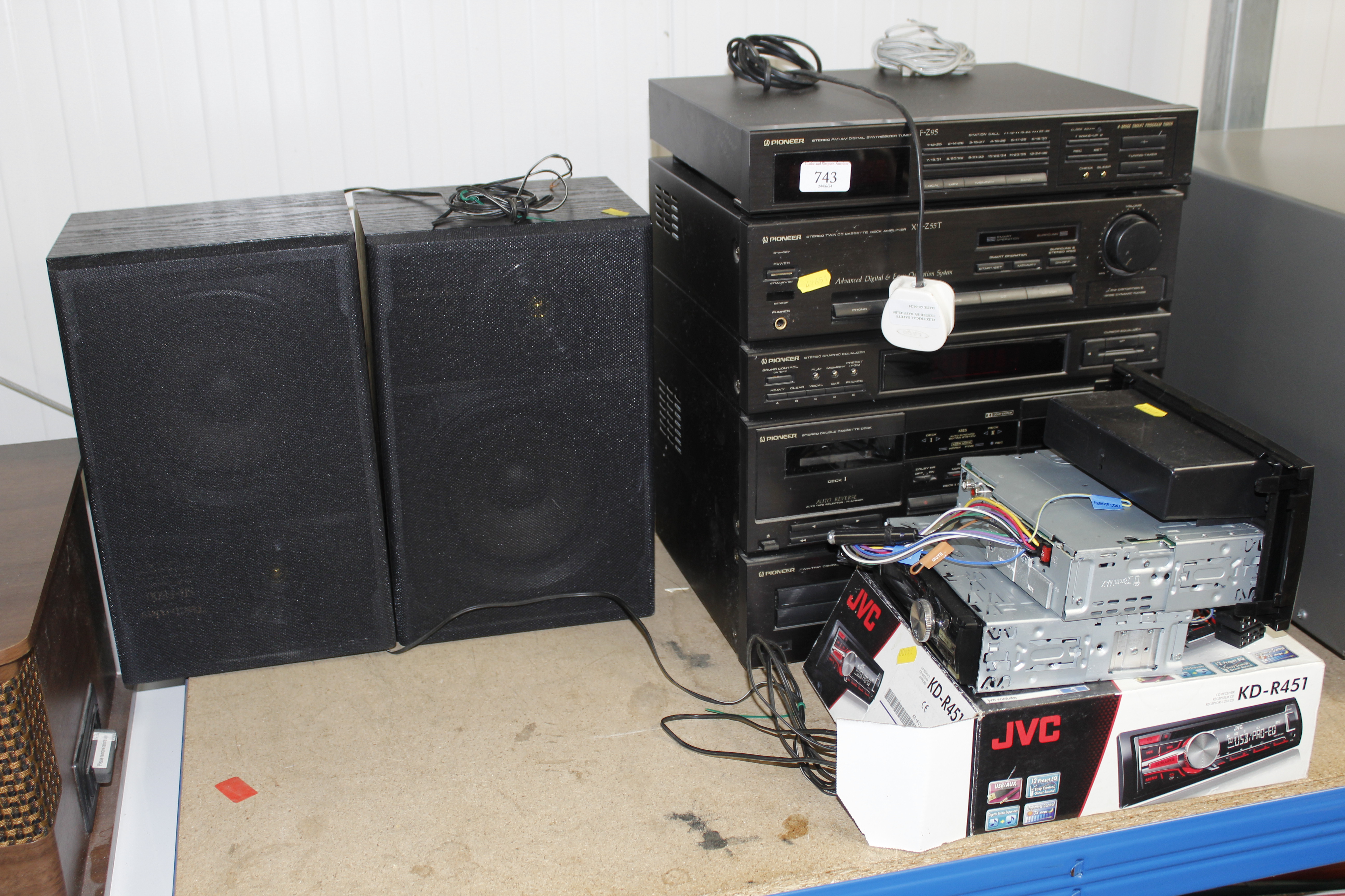 A Pioneer HiFi with two speakers and two car radio