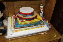 A collection of children's toys, puzzles, two tamb