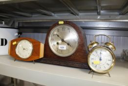 An oak cased two hole mantel clock and two other c
