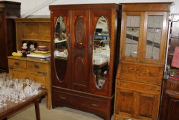 An Edwardian mahogany mirror door wardrobe