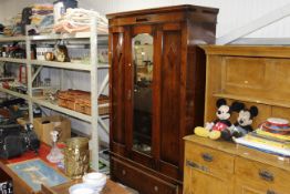 An oak mirror door wardrobe