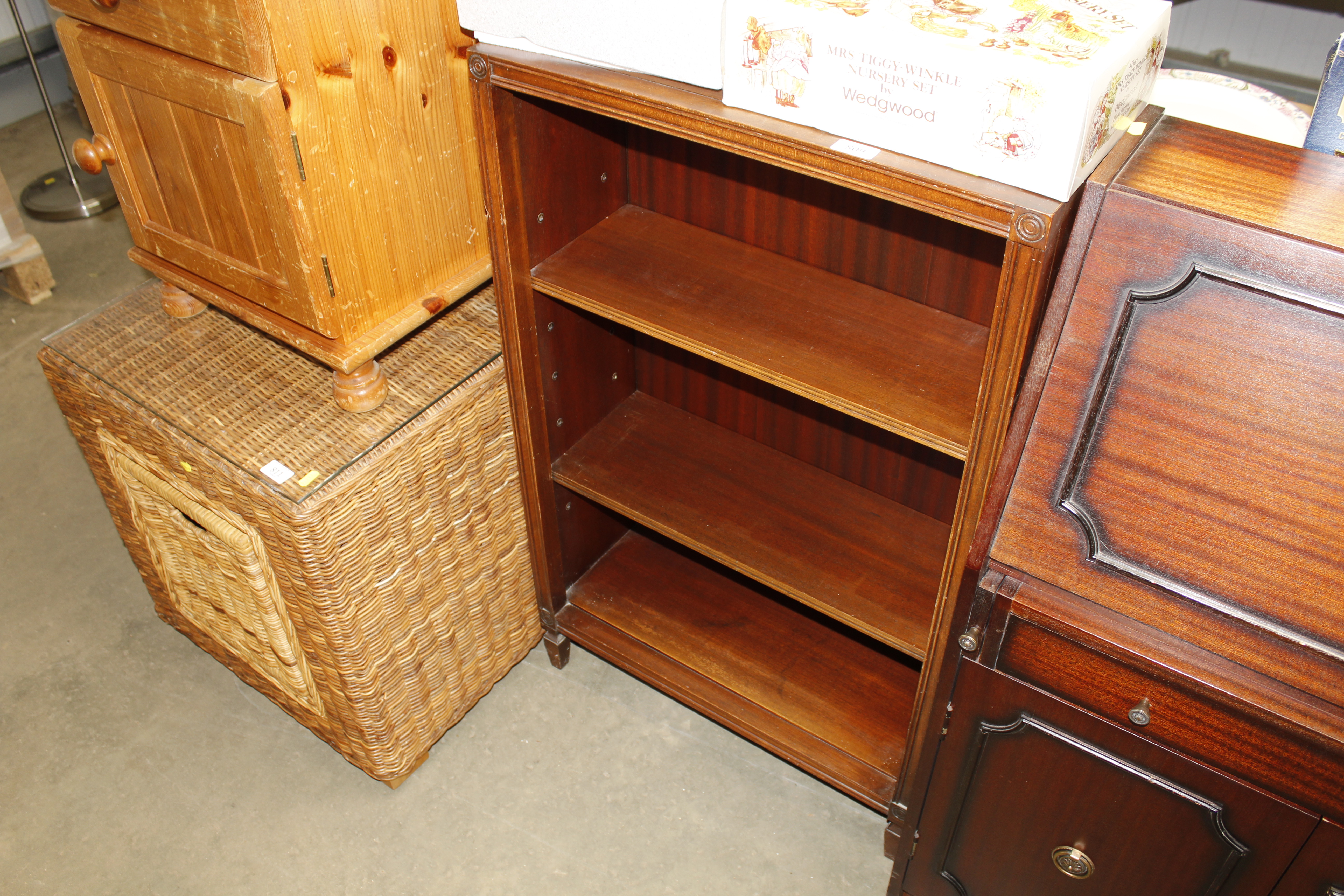 A mahogany open fronted bookcase