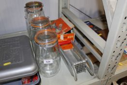 Three Kilner jars and a mincer