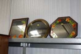 A circular convex mirror and two other mirrors