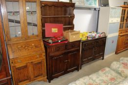 An oak linen fold decorated dresser