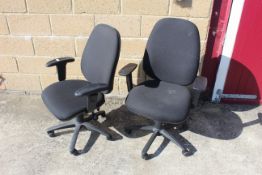 A pair of revolving adjustable office chairs with arm rests SUBJECT TO VAT