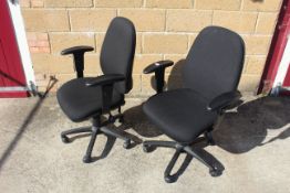 A pair of revolving adjustable office chairs with arm rests SUBJECT TO VAT