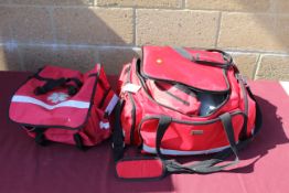Two first responder's kit bags with some contents to include stethoscopes, blood pressure testers,