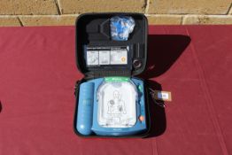 A Philips HeartStart defibrillator in hard carry case. Will require servicing/ recommissioning prior
