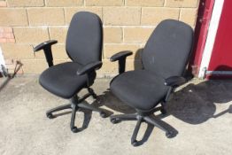 A pair of revolving adjustable office chairs with arm rests SUBJECT TO VAT
