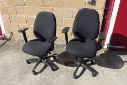 A pair of revolving adjustable office chairs with arm rests SUBJECT TO VAT