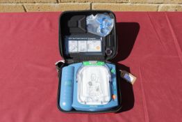 A Philips HeartStart defibrillator in hard carry case. Will require servicing/ recommissioning prior