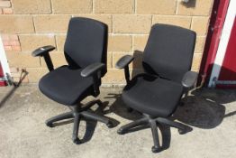 A pair of revolving adjustable office chairs with arm rests SUBJECT TO VAT