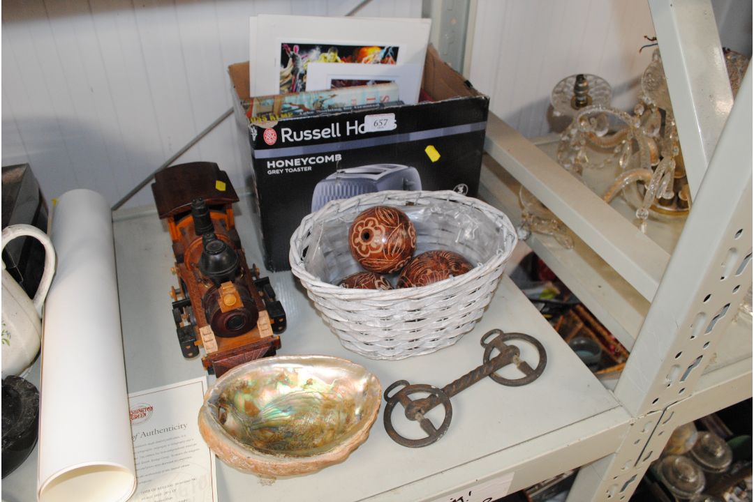 A model wooden train; an Abalone shell; a horses b