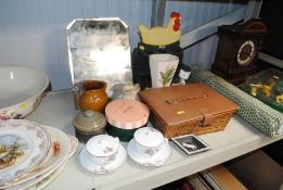 A wicker sewing basket and contents; a bevel edged