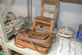 A child's rush seated chair and a satchel