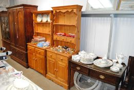 A small stripped pine kitchen dresser