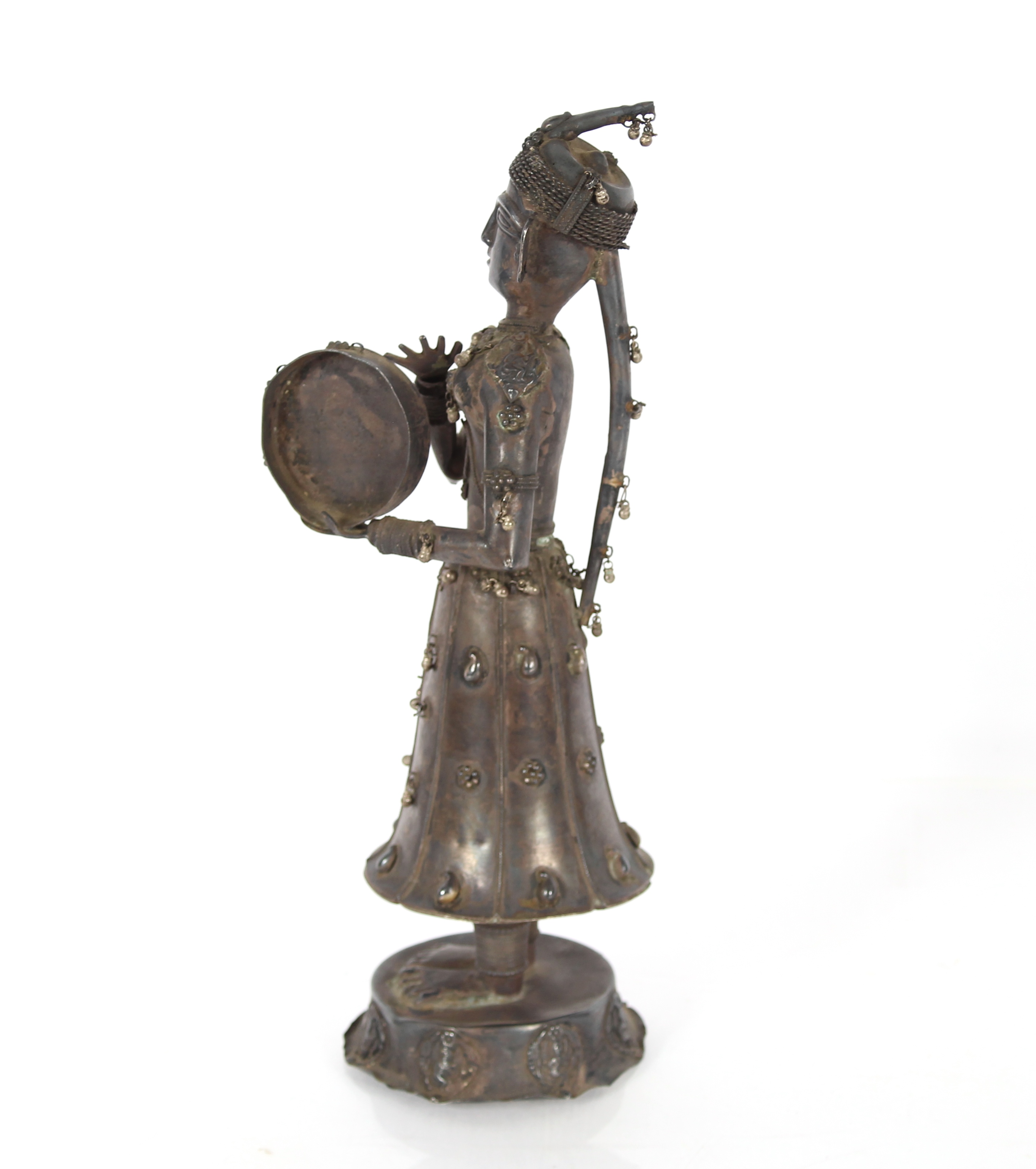 A 19th Century Indian silver figure of a musician, 30cm high - Image 2 of 4