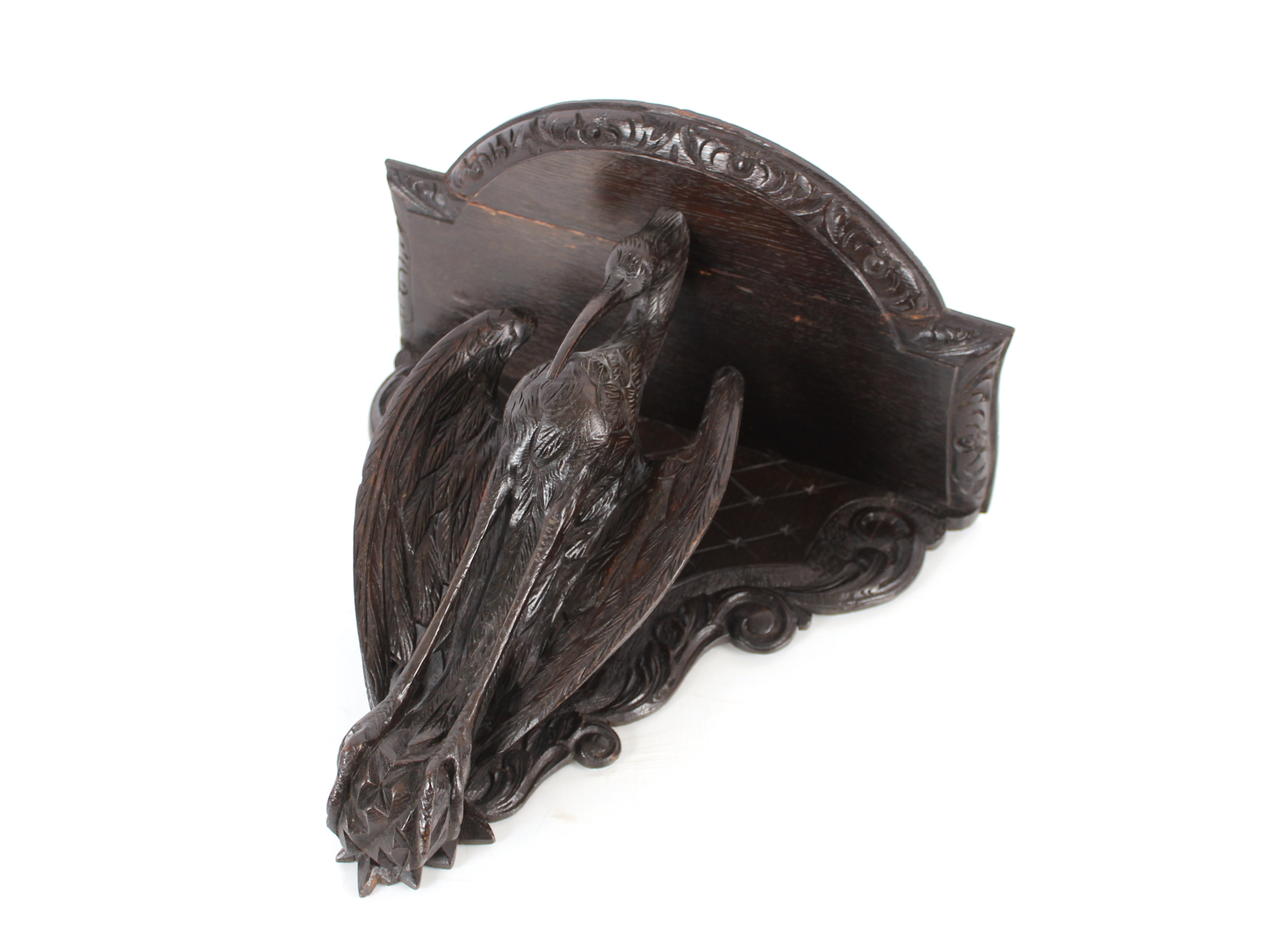 A Victorian ornately carved wall bracket in the form of a bird, 38cm x 39cm in extremes