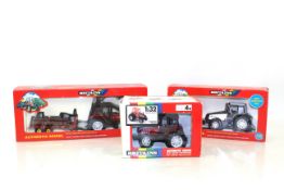 A Britains Valmet logging tractor and trailer, No.9627; a Britains Valmet tractor and snow plough,