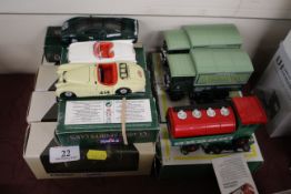 A Corgi Classic 96870 Morris Minor Traveller; another 96753 Morris Minor convertible; two other