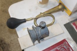 Klaxon ES car horn and a brass vintage car horn.