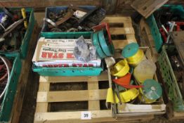 Pallet containing clay traps, sprockets and fasten