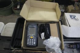 T&T Netcom ear tag scanner.