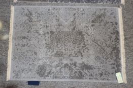 An approx. 3' x 2' Nirvana Peace pattern rug
