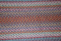 An approx. 8' x 2' oval blue Carnival runner