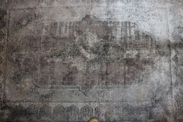 An approx. 6' x 4' Toros Overdye frost grey rug