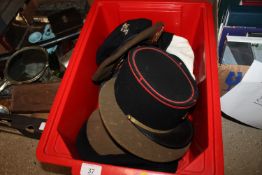 A box of miscellaneous military hats including a F