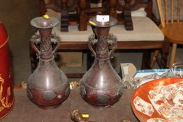 A pair of oriental bronze baluster vases