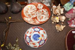 A Japanese Kutani ware charger, decorated cockerels and foliage and an Imari scallop bordered plate