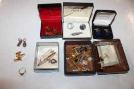 A box containing two silver ingot pendants; a pair