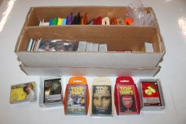 A box containing various Star Wars cards and Top Trump cards