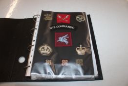 A collection of various military cloth badges moun