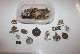 A box of assorted military buttons and badges etc.