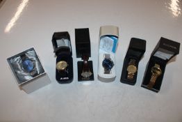 A box containing Sekonda and Lorus wristwatches