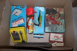 A box of various vintage tin and other toys