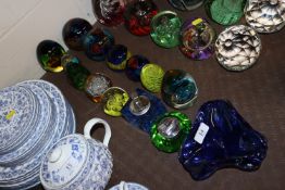 Various coloured glass paperweights, vintage table cigarette light, blue glass ashtray etc.