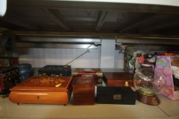 A collection of wooden trinket boxes and a glass m