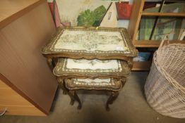 A nest of three gilt Florentine occasional tables