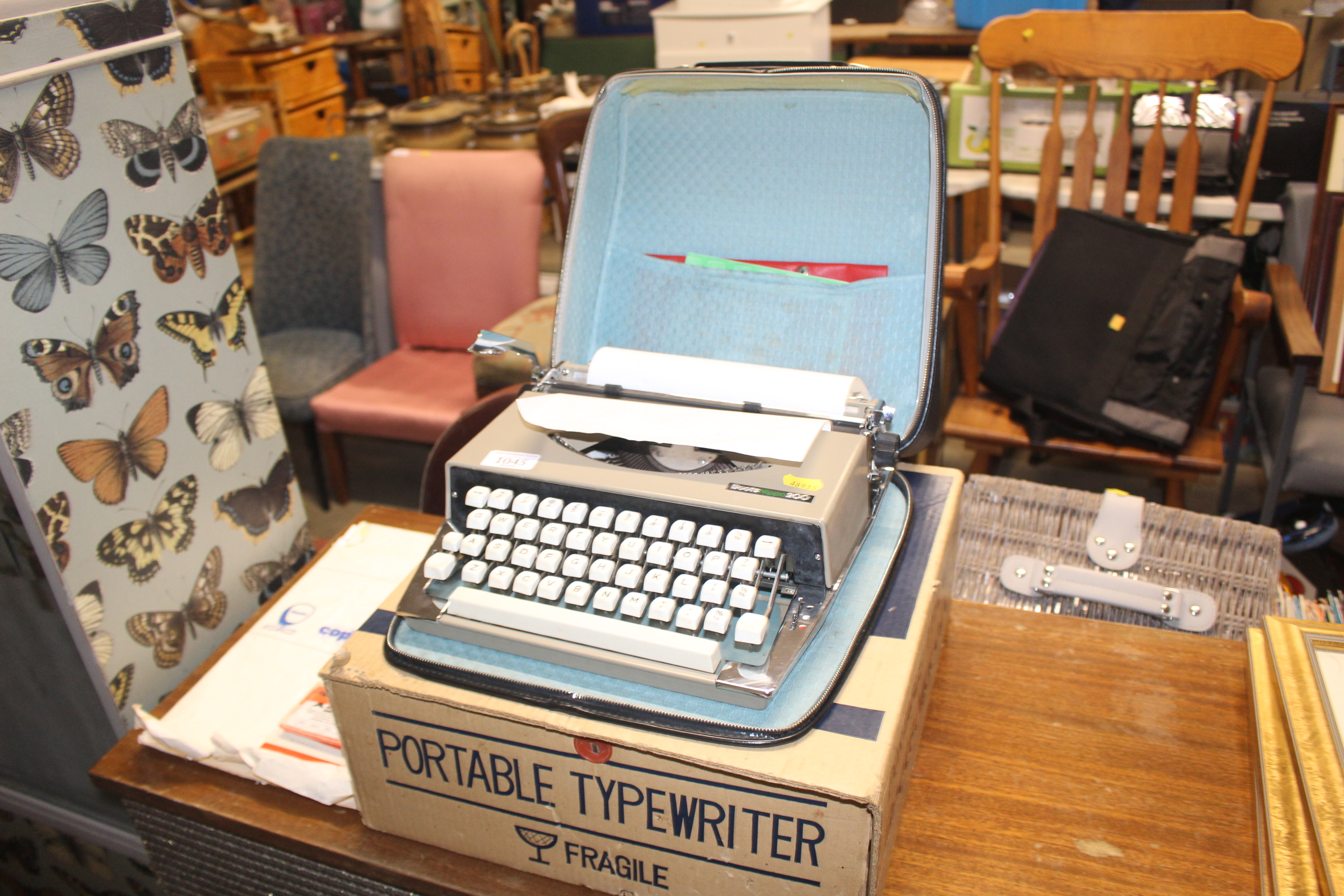 A Boots Nippo 200 portable typewriter with origina