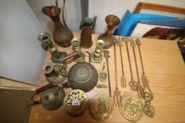 A collection of brass and copperware including can