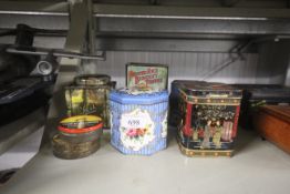 A collection of advertising tins